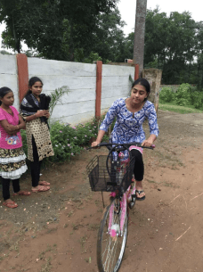 Riding a bicycle in Karanjo - a primary mode of transportation in the village. 